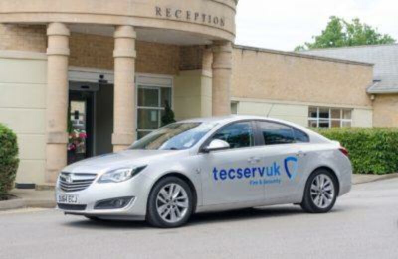 Car arriving outside building